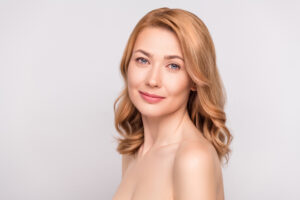 Woman smiling after a visit to All Glow Med Spa in Waxahachie, TX